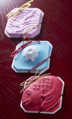 three different shaped cookies sitting on top of a table