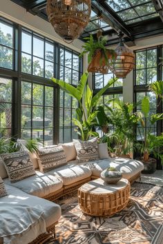 a living room filled with lots of furniture and plants on top of it's walls