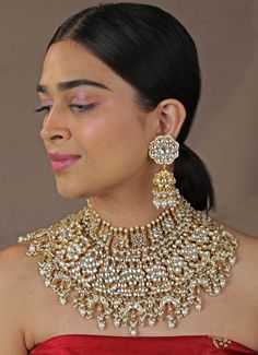 Double Layered Floral Bridal Necklace Set Riana by Shikha Jindal - Fabilicious Fashion Traditional Yellow Gold Kundan Necklace For Reception, Traditional 22k Gold Kundan Necklace For Reception, Kundan Bridal Necklace In Yellow Gold, Hand Set Kundan Bridal Necklace In Yellow Gold, Yellow Gold Kundan Bridal Necklace With Hand Set, Elegant Jewelry With Zari Work For Reception, Gold Plated Temple Jewelry Bridal Necklace For Reception, Elegant Zari Work Jewelry For Reception, Heavy Kundan Necklace In 22k Gold For Reception