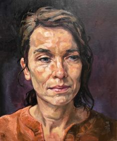 an oil painting of a woman's face with brown shirt and hair in the wind