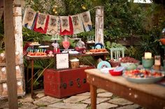 an outdoor party with food and decorations