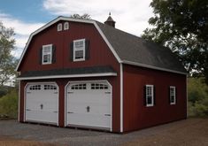 a red two story garage with three windows