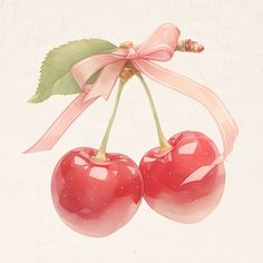 two cherries with pink ribbon tied around them