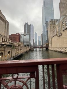 a river running through a city next to tall buildings