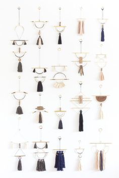 the wall is filled with different types of tassels