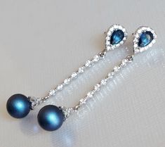 Navy Blue Dark Blue Iridescent Pearl CZ Silver Long Dangle Wedding Bridal Earrings.  PLEASE READ ITEM DESCRIPTION and SHOP POLICIES before placing your order, and contact me with any questions! EARRINGS are about 1.77 inch (4.5cm) long from top of earring stud to bottom. Pearls are 8mm. BRIDAL EARRINGS SECTION: https://www.etsy.com/shop/LanaChayka?ref=seller-platform-mcnav§ion_id=11638940 BRIDAL JEWELRY SETS SECTION: https://www.etsy.com/shop/LanaChayka?ref=seller-platform-mcnav§ion_id=25839214 Luxury Blue Pearl Earrings For Pierced Ears, Blue Drop Bridal Earrings For Formal Events, Blue Drop Bridal Earrings For Formal Occasions, Blue Teardrop Pearl Earrings For Formal Occasions, Blue Dangle Bridal Earrings For Formal Occasions, Formal Blue Dangle Bridal Earrings, Blue Drop Bridal Earrings For Party, Blue Pearl Drop Earrings For Formal Occasions, Formal Blue Pearl Drop Earrings