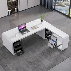 a computer desk with a laptop on top of it