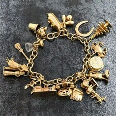 Marked 14k On Many Charms, And On Charm Bracelet. One Charm (Ship) Is 9k Weighs 46.7 Grams  Bracelet Measures 8 1/2" Long  Charm Sizes Vary. They Consist Of Anniversary Cake Celebratory Charm That Opens, Bermuda, Horse & Carriage, Island Woman With Basket On Head, Orioles Baseball Glove, Crab, Old Fashioned Telephone, Tree, House, Lucky Horseshoe, Bowling Pin & Bowling Ball, Ship, Tribal Figure, Bride & Groom, Hula Island Girl, Guitar/Ukulele,  Bar Shaker, And Bar Glass (17 Charms Total!) Great Pre-Owned Condition, Please Enlarge Photographs For Details, Extra Photographs Cheerfully Provided Upon Request! :) B00295 Old Fashioned Telephone, Justin Hayward, Orioles Baseball, Travel Keepsakes, Guitar Ukulele, Lucky Horseshoe, Horse Carriage, Bowling Ball, Gold Charm Bracelet