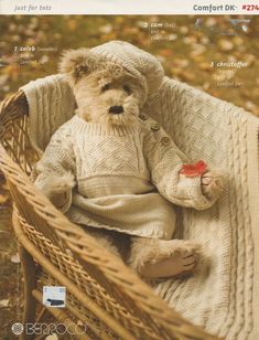 a teddy bear sitting in a wicker basket