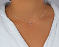 Tiny CZ diamond Choker, Sterling Silver Necklace with Solitaire Cubic Zirconia Diamond, Dainty Layering Choker Dainty and minimalist, this choker necklace is made with a brilliant cut solitaire CZ diamond in the prong setting. Attached on a short sterling silver chain, delicate yet strong, it is perfect for layering or wearing alone. Perfect present for the ones you love if you beat the temptation to live it for your self. ⭐️ Details Sterling Silver chain, delicate yet strong Brilliant cut solit Silver Diamond Necklace, Layered Chokers, Diamond Choker, Solitaire Necklaces, Pretty Jewelry, Choker Necklaces, Cz Diamond, Slovenia, Sterling Silver Chain