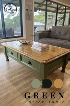 a green coffee table in front of a couch and window with the words green coffee table on it