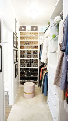 a walk in closet filled with lots of clothes and shoes on shelves next to a white rug