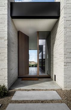 an entry way with stone steps leading up to the door