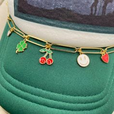 Add some bling and personality to your trucker hat or baseball cap. This lucky style is so trendy with cherry, clover, hearts, & smiley charms. Clasps included and are easily attached to the mesh on the cap. Take your style up a notch! Cap not included. //CAP CHAIN SHOWN IN LISTING// Lightweight Large Paper clip link chain gold plated Clasps on ends to attach in mesh Nickel Free components Chain part measures 8″ Fits trucker or regular ball caps Jewelry arrives gift ready in a lovely box. //CARE Trucker Hat Charms, Work Shirt Outfit, Trucker Hat Ideas, Hat Charms, Soft Jewelry, Cute Cap, Hat Jewelry, Cute Caps, Charm Chain