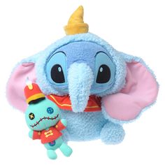 an elephant stuffed animal with a small toy