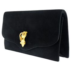 Circa 1975, 18k, by Hermes, France. This spectacular Hermes handbag is decorated with a removable 18k yellow gold buckle brooch. Clutch and pin together or buckle pin worn separately, the look is sidewalk-to-catwalk chic! Excellent condition. The suede retains a slight odor of perfume, this can be mitigated by a leather professional. Remark: "Hermes is not just iconic, it is an iconic lifestyle.” SIZE: Brooch is 1 3/4 inches long by 1 inch wide, and the clutch is 8 3/4 inches long by 5 inches wide WEIGHT: Brooch is 24.8 grams STONES: None HALLMARKS: On brooch, HERMES, Paris, French eagle heads for 18k, goldsmith's mark and registration number, the leather clutch is marked HERMES, Paris, and Made in France. STOCK NUMBER: 24477 Pieces acquired from this dealer must delight you. Purchases may Vintage Hermes Jewelry, Hermes Gold Jewelry, Hermes Wallet On Chain, Hermes Kelly Bracelet Gold Metal, Hermes Jige Clutch, Eagle Head, Hermes Handbags, Vintage Bags, Leather Clutch