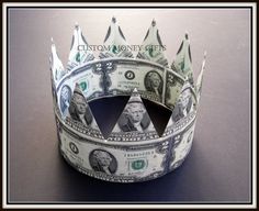 a crown made out of money sitting on top of a table