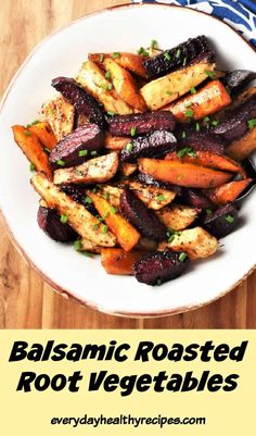 roasted root vegetables in a white bowl on a wooden table with text overlay that reads balsamic roasted root vegetables