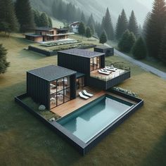 three houses in the middle of a grassy area with a pool and lounge chairs on it