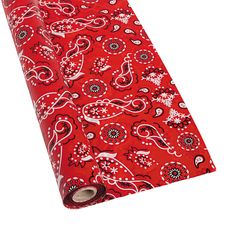 a roll of red and black paisley wrapping paper on a white background with the word,