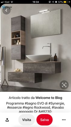 a bathroom sink sitting under a mirror next to a wooden shelf with shelves on it