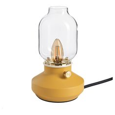 a yellow table lamp with a glass dome on top and a black cord connected to it