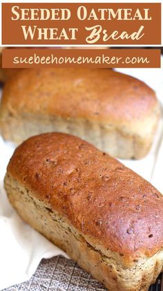 two loafs of bread sitting on top of a table next to each other with the words, seeded oatmeal wheat bread