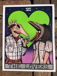 the lovers tarot card with an image of a man and woman holding each other's hands