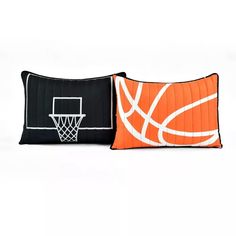 two pillows with basketballs on them are sitting next to each other in front of a white background