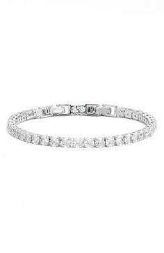 Prong-set round cubic zirconia illuminate a sparkly tennis bracelet that's perfect to stack or wear solo. 7" length; 2" extender; 1/8" width Fold-over clasp 14k-gold layer or platinum layer/cubic zirconia Imported Tennis Bracelet, Womens Jewelry Bracelets, Prong Setting, Cubic Zirconia, Platinum, Tennis, Silver Tone, Gold Tones, Nordstrom