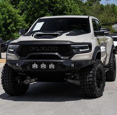 a white ram truck parked in a parking lot