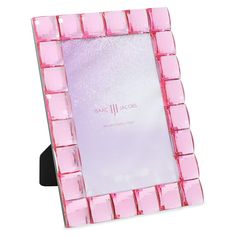 a pink and black photo frame with squares on it's sides, in front of a white background