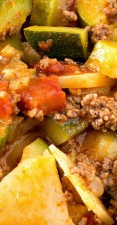 the dish has zucchini, meat and sauce on it