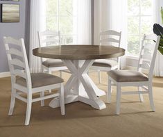 a dining room table with chairs around it