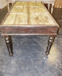 an old wooden bed frame sitting on top of a floor