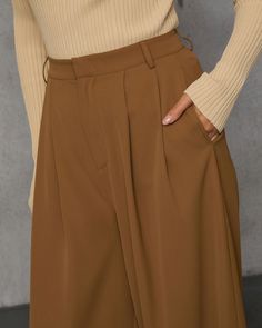 Trendy babes will love the Madrigal Pocketed Wide Leg Pants that goes with everything and features a relaxed, wide leg fit. It's an elevated and versatile basic that belongs at the center of your capsule wardrobe. High rise Wide pant leg Pocketed Front zip fly and hook closure Not lined 100% Polyester Sleeveless Cardigan, Swimwear Bottoms, Wide Pants, Wrap Sweater, New Tops, Hat Hairstyles, Long Sweaters, Western Wear, Sweater Accessories