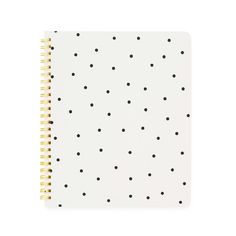 a white notebook with black dots on it