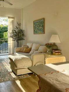 a living room filled with furniture next to a sliding glass door leading to a balcony