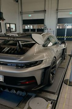 a car being worked on in a factory