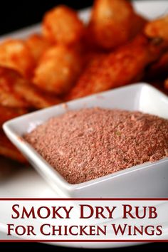 the words smoky dry rub for chicken wings on a plate