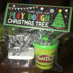 play dough christmas tree and play doh treat in plastic bag on table with sign