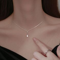 This sparkling, delicate zirconia sits on a pear shaped water drop pendant giving the necklace an elegant touch. The necklace creates a stylish look that can be styled with any outfit. Wear it alone or layered it with our other necklaces. Details 18K Gold Plated on 925 Sterling Silver with zircon stones Chain: 16" + 2" extender Pendant Size: 0.12" by 0.17" Dainty & Fine Delivered in Poppy Mae custom jewelry boxes ready to be gifted Avoid contact with any chemicals or alcohol. Please refer to our Simple Elegant Necklace, Silver Necklace Simple, Pretty Jewelry Necklaces, French Jewelry, Prom Jewelry, Jewelry Lookbook, Teardrop Necklace, Elegant Necklaces, Girly Jewelry