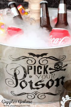 an ice bucket filled with bottles of beer and some drinks in the tub that says pick your poison