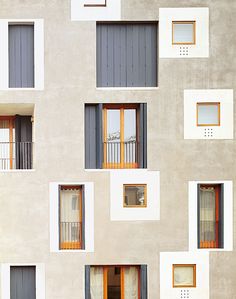 the building has many windows and balconies on it