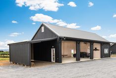 an empty garage with two cars parked in the front and one on the other side