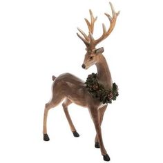 a statue of a deer with antlers on it's head and wreath around its neck