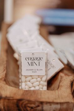 a wooden tray topped with lots of white candies