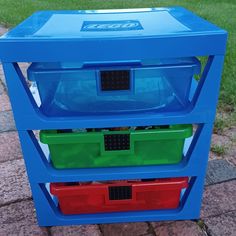 three plastic containers stacked on top of each other