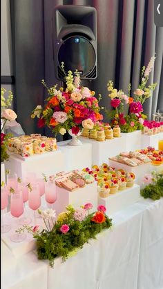 an assortment of desserts and drinks on a table at a wedding or other function