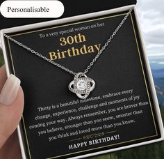 a woman holding up a birthday card with a necklace on it's neck and the message, happy birthday to every special woman on her 30th